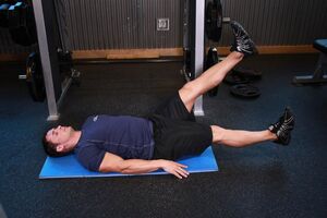 Man with prostatitis exercise in a gym